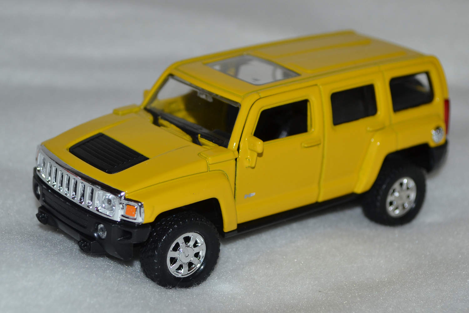 Hummer H3 Gul 1:34, 1:39 Welly Nex Pullback Ny