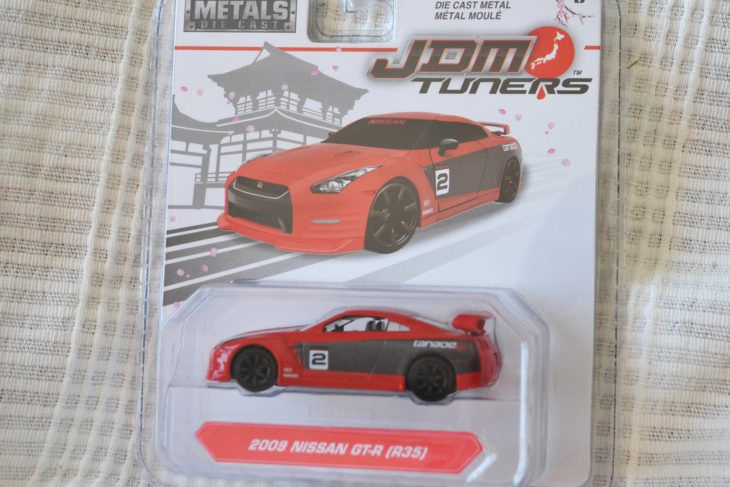 2009 Nissan GT-R (R35) Röd/Svart Racing 1:64 Jada Toys (JDM